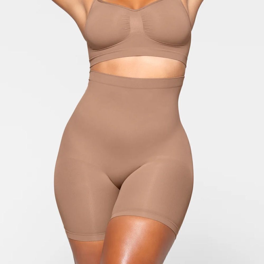 SKIMS Sculpt Seamless Shaping Mid Thigh High Waisted Shorts In Umber